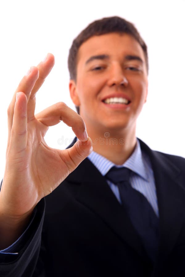 Jonge zakenman die een duim omhoog steekt stock fotografie