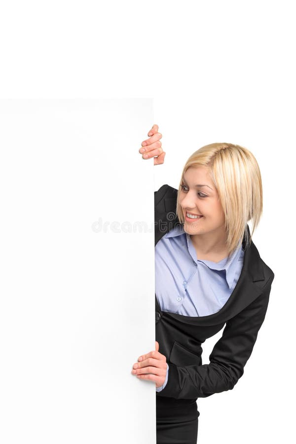 Jonge blonde onderneemster die witte banner bekijkt stock afbeeldingen Jonge blonde onderneemster die witte banner bekijkt stock afbeeldingen