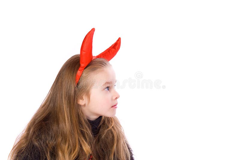 Young Child Dressed in a Devil Costume on White Background. Young Child Dressed in a Devil Costume on White Background