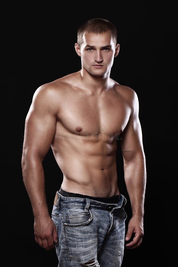 Jonge en sexy kerel die jeans dragen stock afbeeldingen Jonge en sexy kerel die jeans dragen stock afbeeldingen