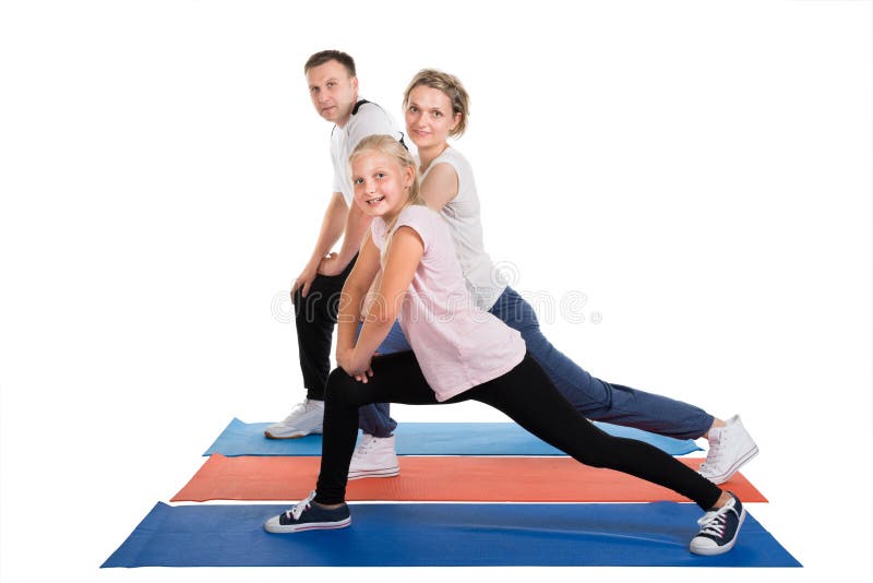 Young Family Doing Stretching Exercises. Isolated On White. Young Family Doing Stretching Exercises. Isolated On White