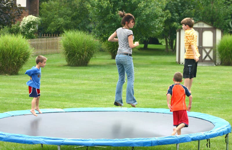 Four children having a great time jumping on trampoline. Four children having a great time jumping on trampoline