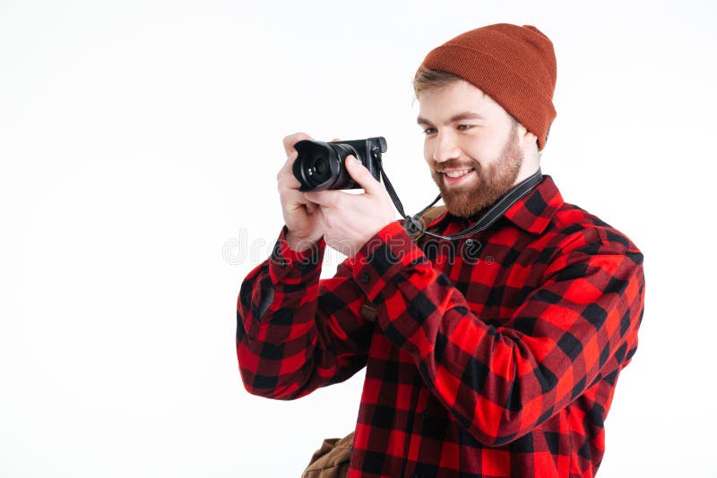 Jonge hipsterkerel die beeld met fotocamera nemen royalty-vrije stock foto's Jonge hipsterkerel die beeld met fotocamera nemen royalty-vrije stock foto's