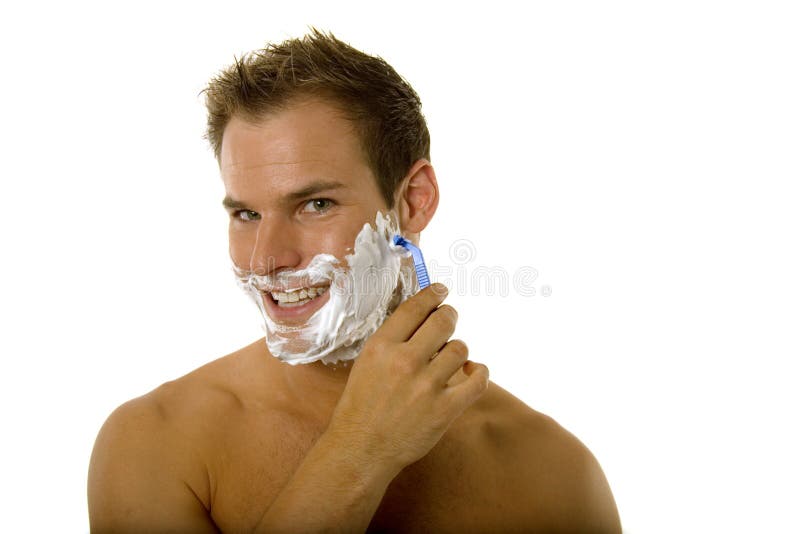Jonge mens die zijn baard scheert stock afbeelding Jonge mens die zijn baard scheert stock afbeelding