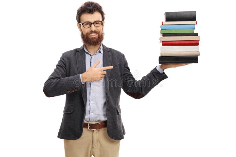 Jonge professor die een stapel van boeken en het richten houden stock afbeelding Jonge professor die een stapel van boeken en het richten houden stock afbeelding