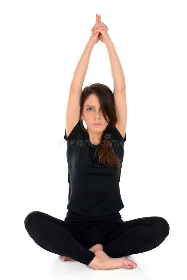 Jonge vrouw die yogaasana Lotus Pose With Hands Up doen stock afbeelding Jonge vrouw die yogaasana Lotus Pose With Hands Up doen stock afbeelding