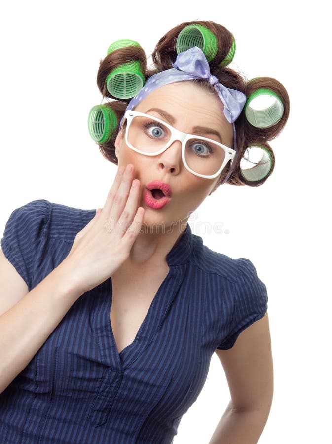 Surprised woman with curlers. Funny girl isolated on white background, studio-shot. Surprised woman with curlers. Funny girl isolated on white background, studio-shot