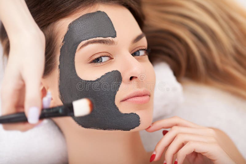 Young women with natural facial mask in beauty spa. Young women with natural facial mask in beauty spa.