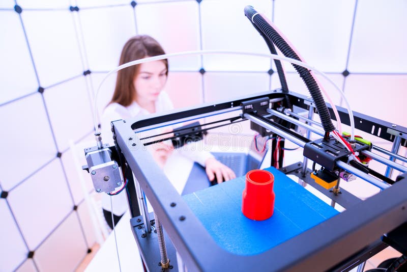 Young woman designer in 3d printing lab. Young woman designer in 3d printing lab
