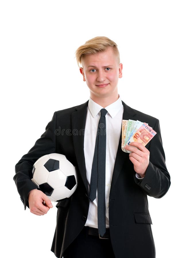 Jonge zakenman met voetbalbal en geld stock fotografie Jonge zakenman met voetbalbal en geld stock fotografie