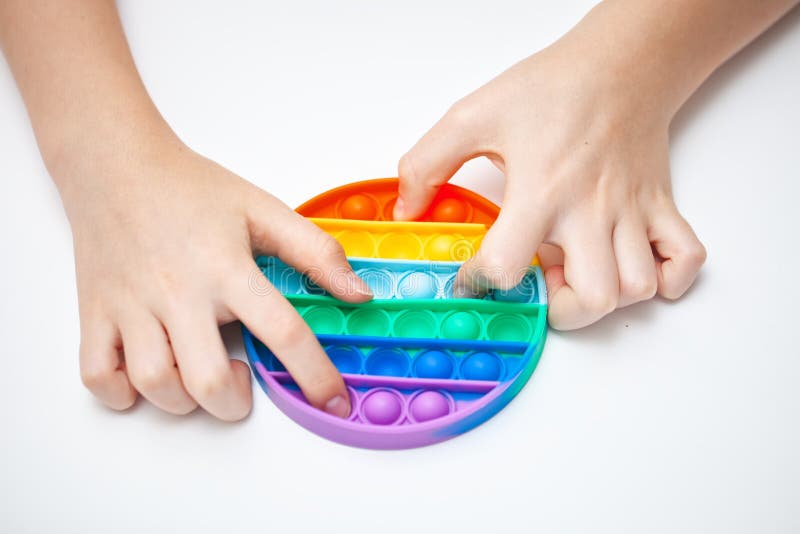 Jouet En Silicone Antistress Dans Les Mains D'un Adolescent. Jouet