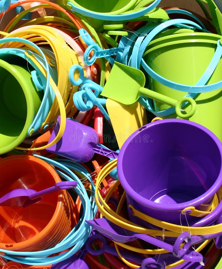 A bunch of colorful beach toys in the sun. A bunch of colorful beach toys in the sun