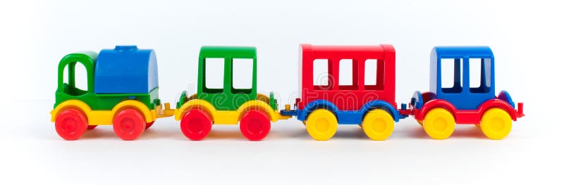 Children's toy, a multi-colored steam locomotive on a white background. banner, panorama. Children's toy, a multi-colored steam locomotive on a white background. banner, panorama