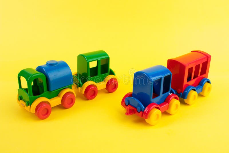 Children's toy, a multi-colored steam locomotive on a yellow background. For the development of the child. Children's toy, a multi-colored steam locomotive on a yellow background. For the development of the child