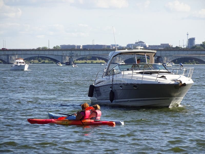 Photo of boats and kayakers on the potomac river in washington dc on 9/7/15-labor day. Boating and kayaking are popular activities. Photo of boats and kayakers on the potomac river in washington dc on 9/7/15-labor day. Boating and kayaking are popular activities.