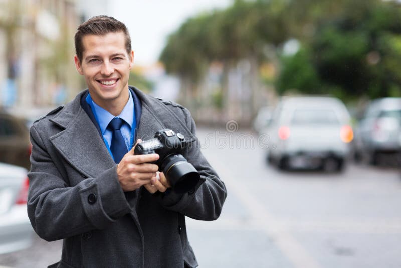 Journalist holding camera stock photo. Image of outdoors 34939772