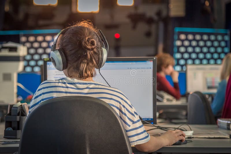 A journalist working on a computer in Newsroom royalty free stock photos