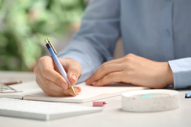 Journalist working at table in office stock photos