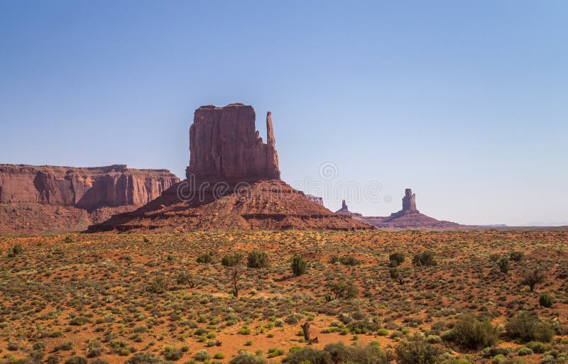 Journey to the legendary wild West of the USA. Picturesque rocks in the Valley of Monuments, Navajo Tribal Park. Journey to the southwest of the USA. Panorama of stock image Journey to the legendary wild West of the USA. Picturesque rocks in the Valley of Monuments, Navajo Tribal Park. Journey to the southwest of the USA. Panorama of stock image