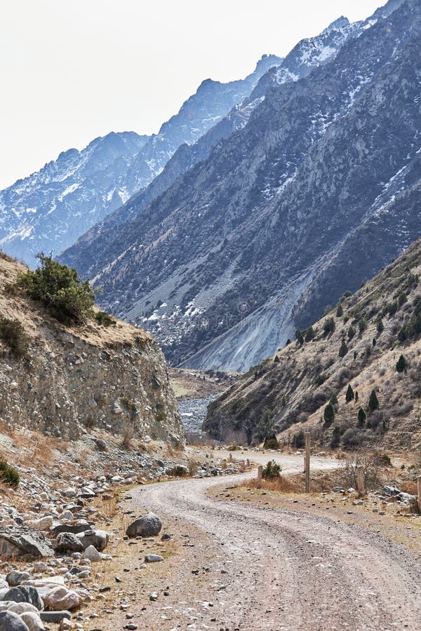 Journey To the Mountains. Winding Road, High Rocky Mountains with Steep