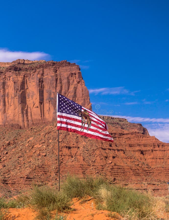 Journey to the Wild West USA. Flag of the Navajo and the rocks of Arizona. Journey to the southwest of the USA. Panorama of the Valley of Monuments in Utah. US stock photos Journey to the Wild West USA. Flag of the Navajo and the rocks of Arizona. Journey to the southwest of the USA. Panorama of the Valley of Monuments in Utah. US stock photos