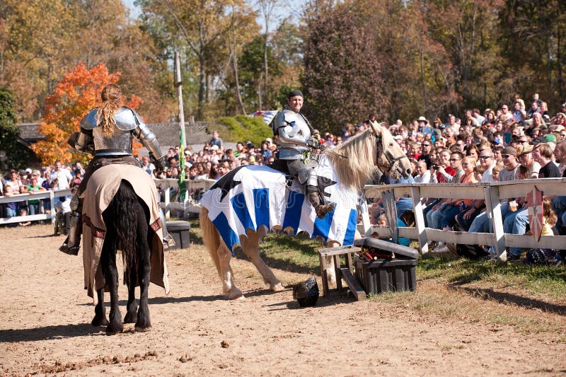 HARVEYSBURG OH,OCTOBER 9 2010- Reigning world champion jousters Shane Adams (left) and Jason Armstrong entertain the crowd before a jousting match at the Ohio Renaissance Festival, October 9, 2010. HARVEYSBURG OH,OCTOBER 9 2010- Reigning world champion jousters Shane Adams (left) and Jason Armstrong entertain the crowd before a jousting match at the Ohio Renaissance Festival, October 9, 2010.