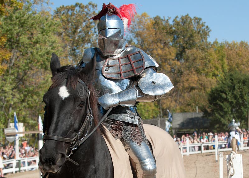 HARVEYSBURG OH, OCTOBER 9 2010 - World champion full contact jouster Sir Shane Adams rides to the starting line in full armor before a jousting match at the Ohio Renaissance Festival, October 9, 2010. HARVEYSBURG OH, OCTOBER 9 2010 - World champion full contact jouster Sir Shane Adams rides to the starting line in full armor before a jousting match at the Ohio Renaissance Festival, October 9, 2010