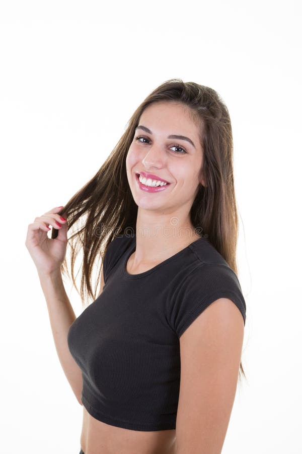 Jovem mulher bonita com o cabelo marrom longo que sente feliz imagem de stock royalty free Jovem mulher bonita com o cabelo marrom longo que sente feliz imagem de stock royalty free