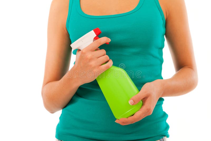 Jovem mulher com garrafa do pulverizador imagens de stock royalty free