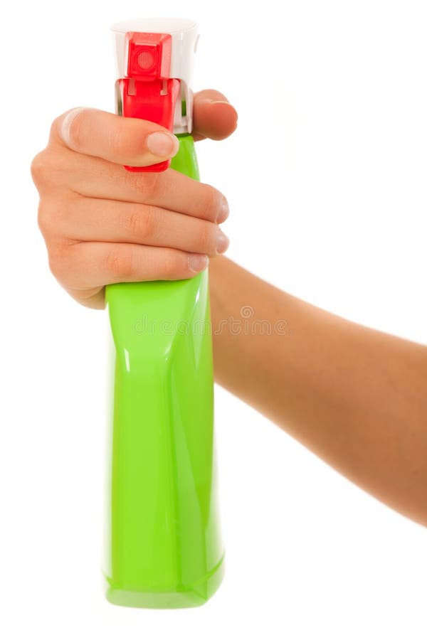 Jovem mulher com garrafa do pulverizador fotografia de stock