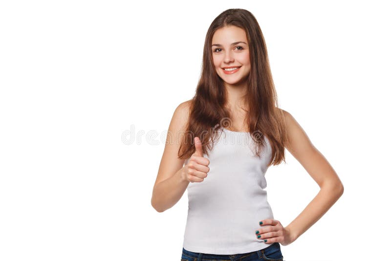 Jovem mulher feliz de sorriso que mostra os polegares acima, isolado no fundo branco foto de stock Jovem mulher feliz de sorriso que mostra os polegares acima, isolado no fundo branco foto de stock