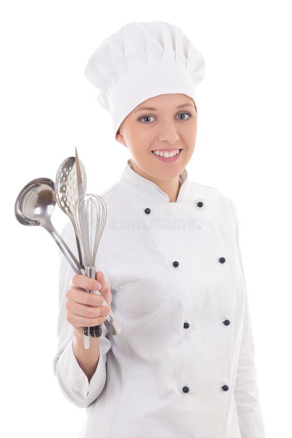 Jovem mulher no uniforme do cozinheiro chefe com o equipamento da cozinha isolado em w fotos de stock Jovem mulher no uniforme do cozinheiro chefe com o equipamento da cozinha isolado em w fotos de stock