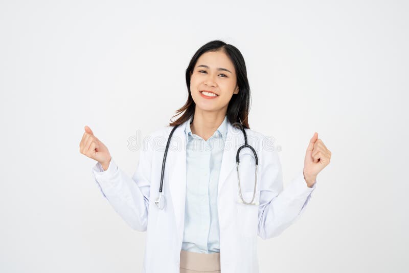 Joven doctora sobre antecedentes aislados celebrando una victoria imagen de archivo libre de regalías