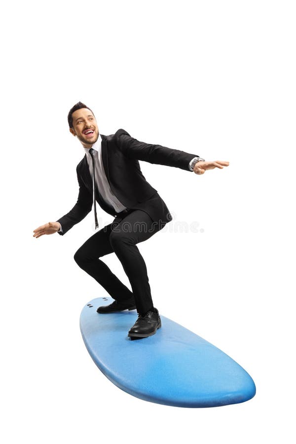 Joven empresario de pie en una tabla de surf fotos de archivo libres de regalías