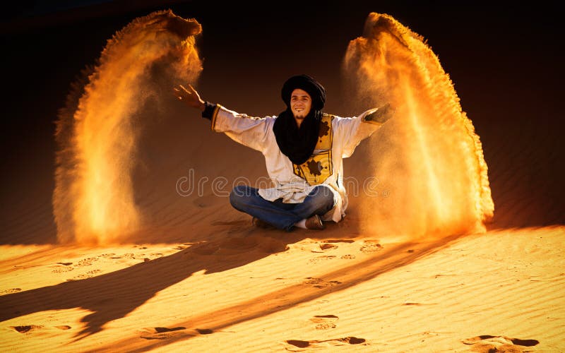 Berber throwing with sands in Desert Sahara, Morocco. Berber throwing with sands in Desert Sahara, Morocco.