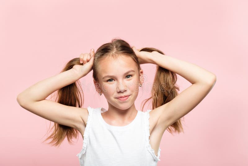 Joyful adolescent girl pig tails hair lifestyle