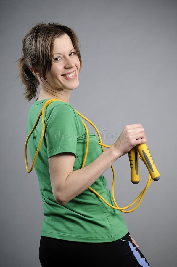 Joyful aerobics instructor smiling