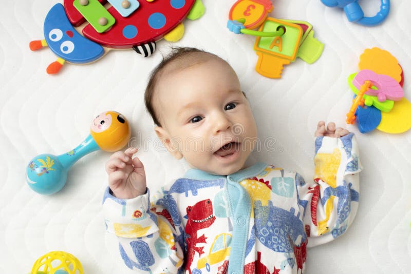 Baby is Played with Colored Cubes, on a White Background Stock Image ...