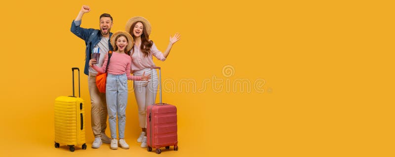 Joyful Family Ready for Vacation With Luggage on Yellow Background royalty free stock images