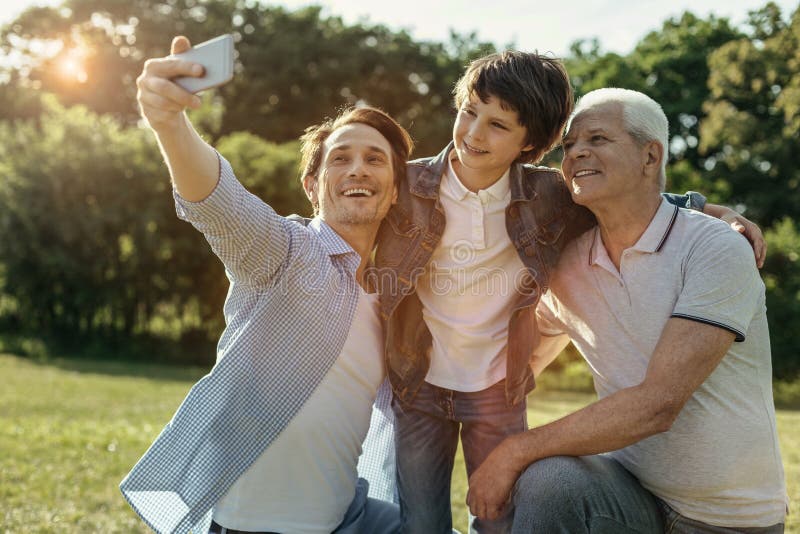 Joyful Family Taking Selfie and Smiling Stock Photo - Image of