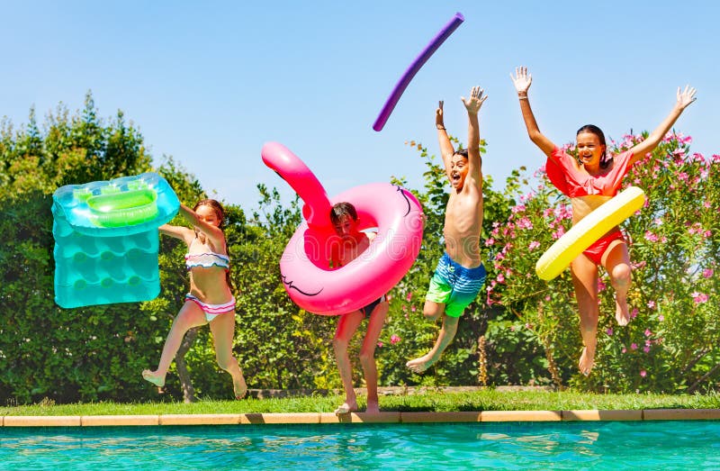 Joyful kids having fun during summer pool party