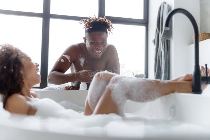 Young lass having fun in the bath