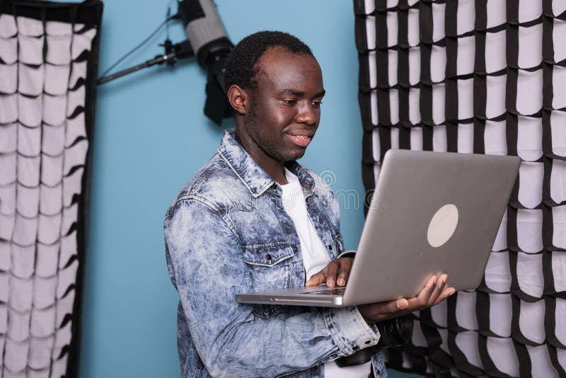 Joyful Production Director with DSLR Camera and Handheld Computer Stock