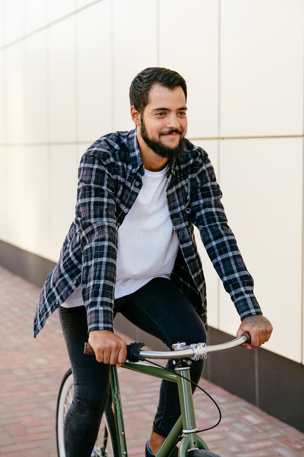 Joyful Stylish Guy Riding a Bike Outdoors Stock Image - Image of ...