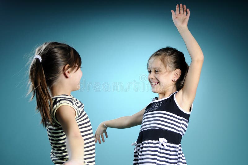 Joyful white twins dancing