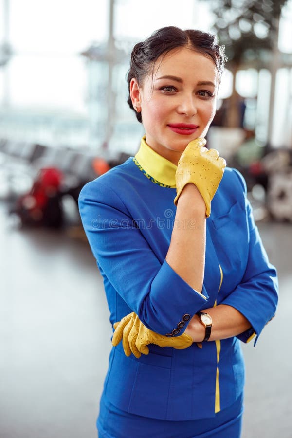 Female Flight Attendant Standing in Airport Terminal Stock Photo ...