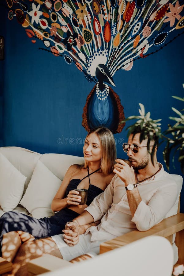 Joyful Woman Drinks A Coffee With Her Husband In Hotel Room Stock Image