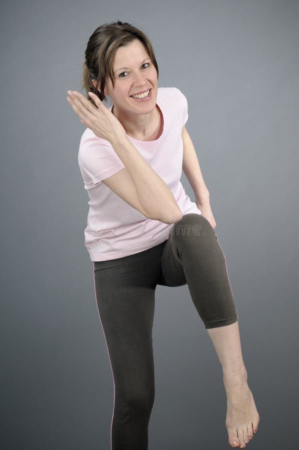 Joyful woman exercising aerobics