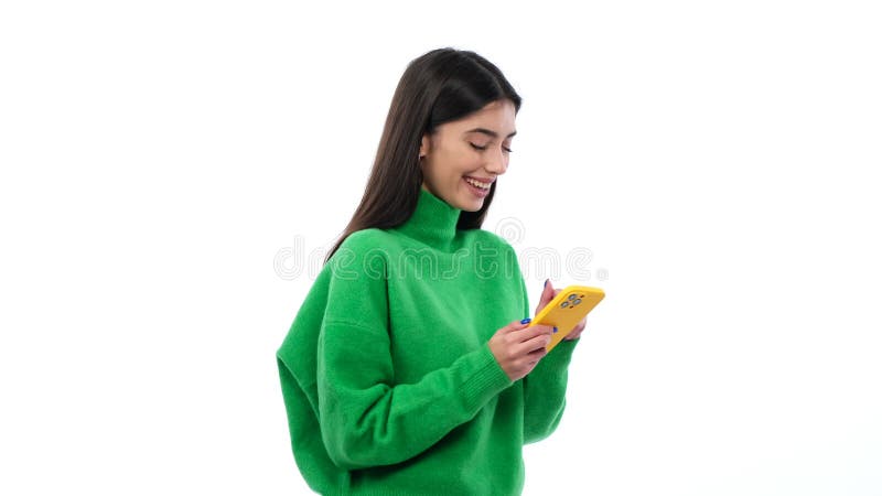 Joyful Young Caucasian Woman Using Cellphone On White Background stock video footage