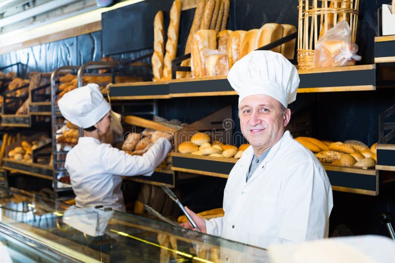 Joyous Bakers with Fresh Bread in Bakery Stock Photo Image of